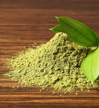 AvoShot on table looks like matcha powder, avocado leaf, caffeine free, all natural, wellness tea, antioxidant tea