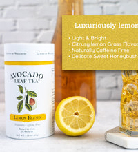 Avocado Leaf Tea Lemon Blend - Avocado Tea Co., iced tea pitcher, half a lemon, luxurious lemon tea